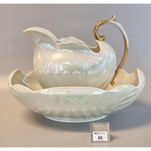 86 - Shelly lustre china shell-shaped jug and basin, jug with gilded handle. (2)
(B.P. 21 + VAT)