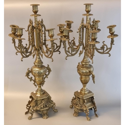 87 - Pair of brass four-branch table candelabrum in classical style. 62cm high approx. (2)
(B.P. 21 + VAT... 