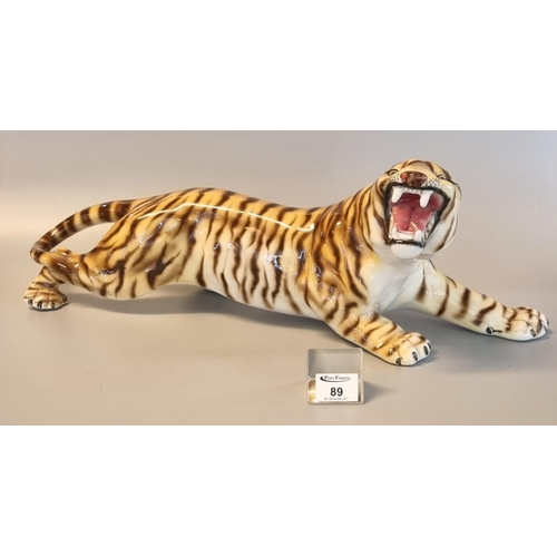 89 - Large Italian china study of a snarling crouching tiger. Printed marks to base, overall 60cm approx.... 