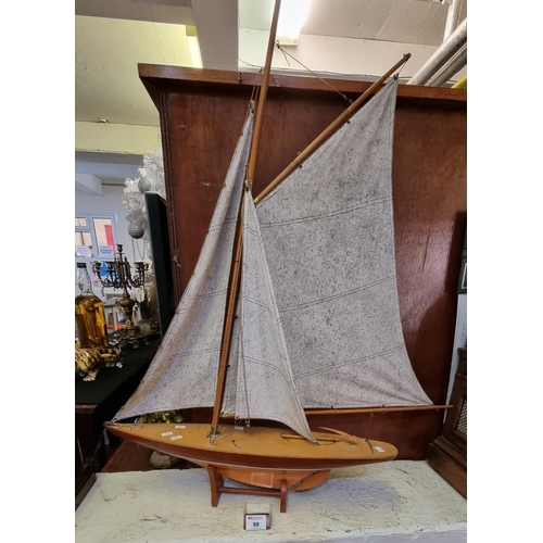 99 - Mid Century model of a three masted yacht on base.
(B.P. 21% + VAT)