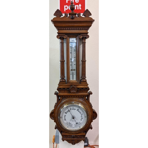 643 - Late Victorian oak wheel barometer of architectural form with thermometer, the face marked 'J Davies... 