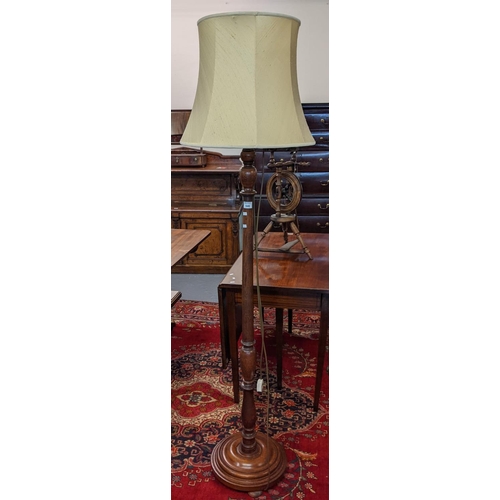 646 - Mid Century oak standard lamp and shade.
(B.P. 21% + VAT)