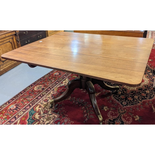 647 - 19th Century mahogany breakfast table standing on a baluster moulded pedestal quatreform base with b... 