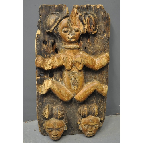 101 - Central/Southern African carved and stained wooden fertility plaque with figural and mask decoration... 