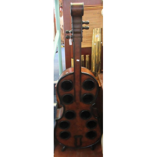 70 - Novelty ten section wine rack in the form of a double bass in burr walnut finish. 
(B.P. 21% + VAT)