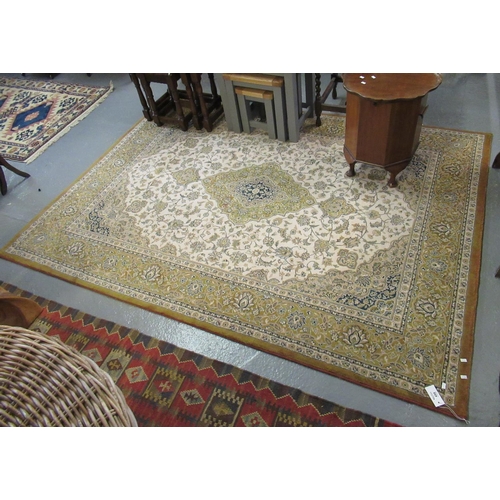 498 - Modern Persian design cream and mustard ground carpet, overall with flowers and foliage and central ... 