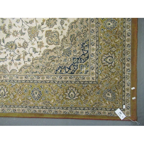 498 - Modern Persian design cream and mustard ground carpet, overall with flowers and foliage and central ... 