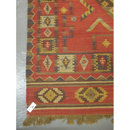 499 - Red ground Kelim rug, overall with multicoloured geometric designs, 160 x 245cm approx.
(B.P. 21% + ... 