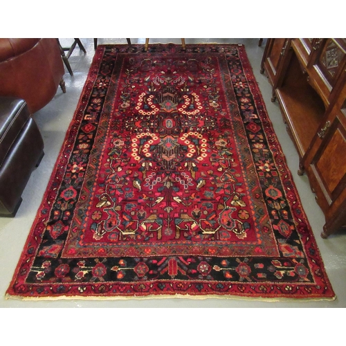 500 - Modern Iranian red ground rug, overall with stylised flowers and foliage. 260 x 158cm approx.2 60 x ... 