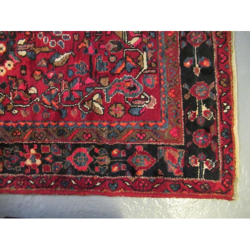 500 - Modern Iranian red ground rug, overall with stylised flowers and foliage. 260 x 158cm approx.2 60 x ... 