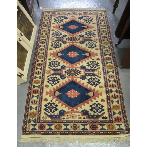 501 - Turkish cream ground runner, overall with multicoloured lozenge and other geometric decoration. 177 ... 