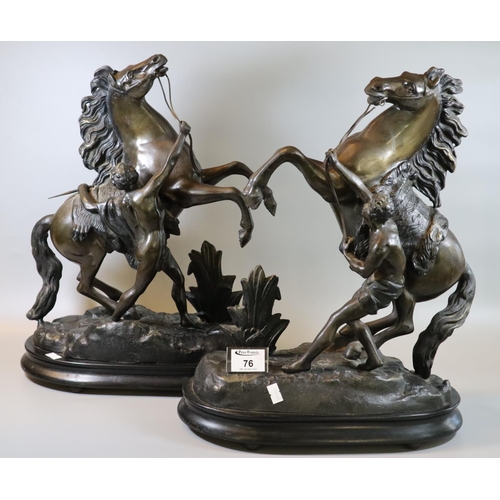 76 - Pair of early 20th century spelter Marley horses and figures on oval naturalistic base. (2)
(B.P. 21... 