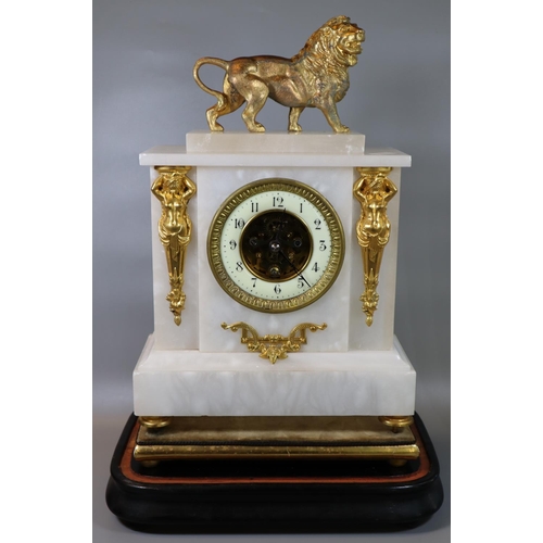 77 - 19th Century Empire design alabaster mantel clock with gilt metal mounts, including lion pediment an... 