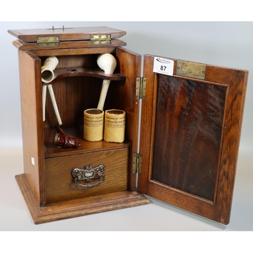 87 - Early 20th century oak single door blind paneled smoker's cabinet, the interior revealing clay and o... 