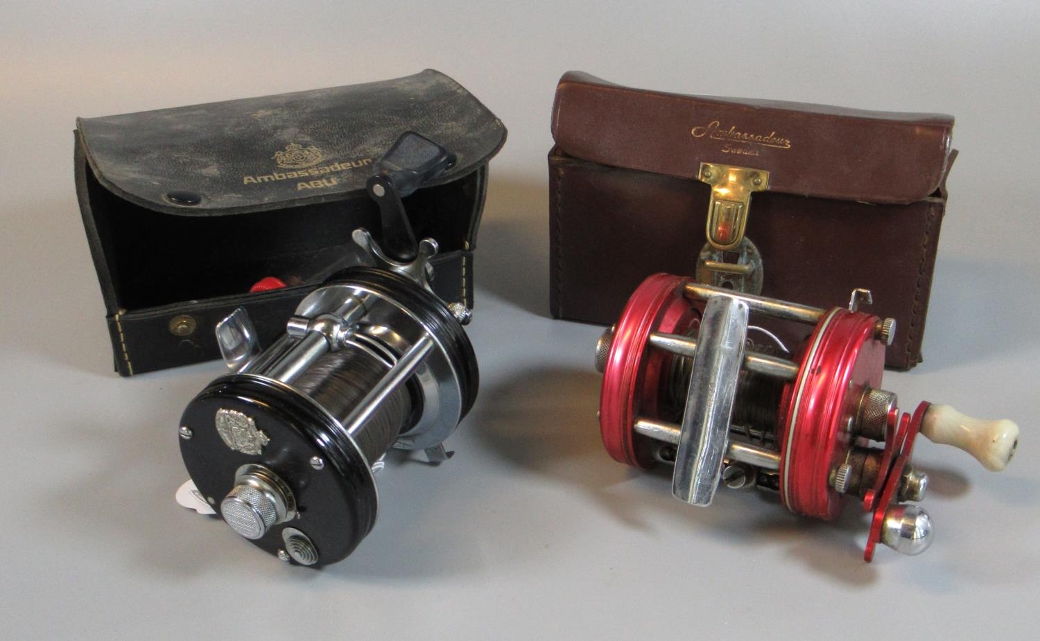 Abu Ambassadeur 6000 fishing reel in leather carrying case, together with  another Abu Ambassadeur 60