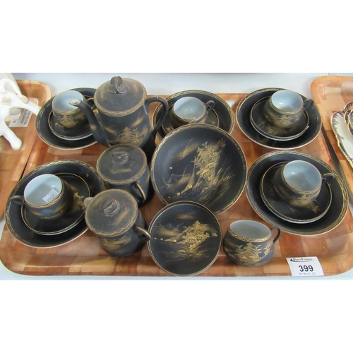 399 - Japanese eggshell coffee set on a black ground with gilded decoration of pagodas within a landscape.... 