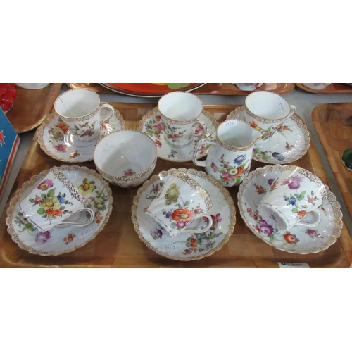 401 - Dresden porcelain part tea service on a white ground with floral sprays, to include six cups and sau... 