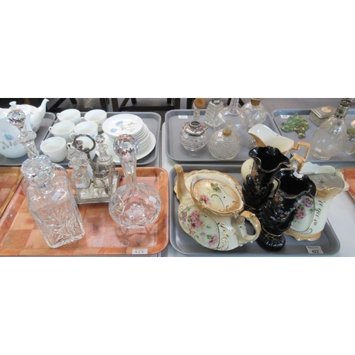 423 - Tray of glass to include three decanters and stoppers and a cruet set with silver plated stand, toge... 