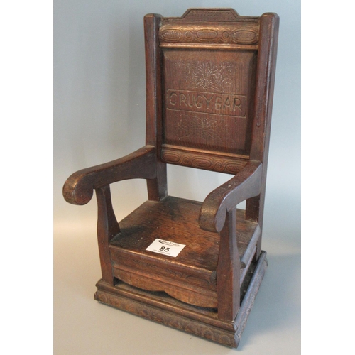 85 - Miniature oak Eisteddfod type chair marked 'CRUGYBAR', dated 1956. 33cm high approx.
(B.P. 21% + VAT... 