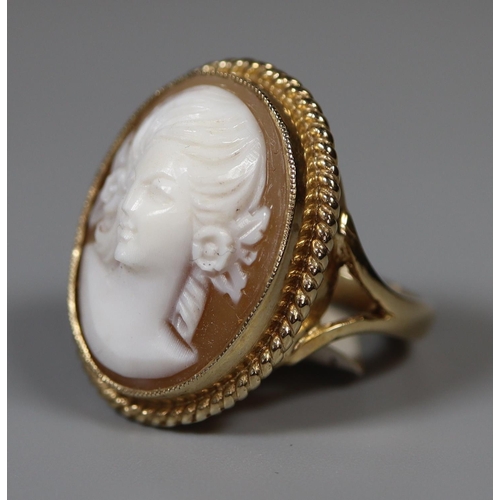 224 - 9ct gold oval shell cameo ring with gold ropework border.  Ring size P.  Approx weight 7.2 grams.
(B... 