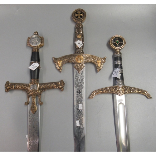 193 - Group of three reproduction crusader type theatrical swords with brass fittings and steel blades, to... 