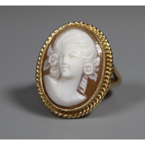 224 - 9ct gold oval shell cameo ring with gold ropework border.  Ring size P.  Approx weight 7.2 grams.
(B... 