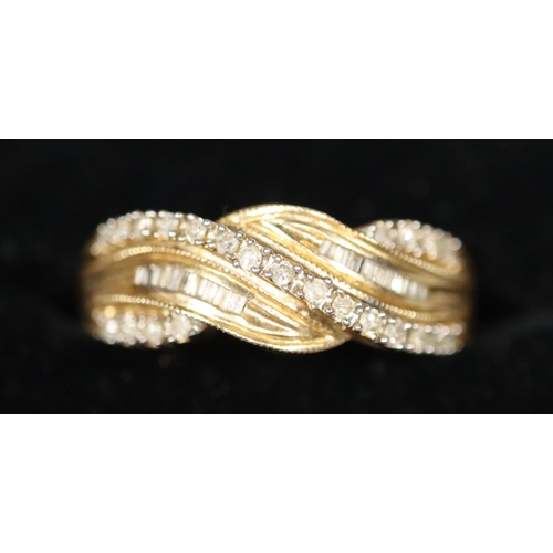 241 - 14ct gold diamond set crossover ring.  Ring size P.  Approx weight 2.7 grams.
(B.P. 21% + VAT)