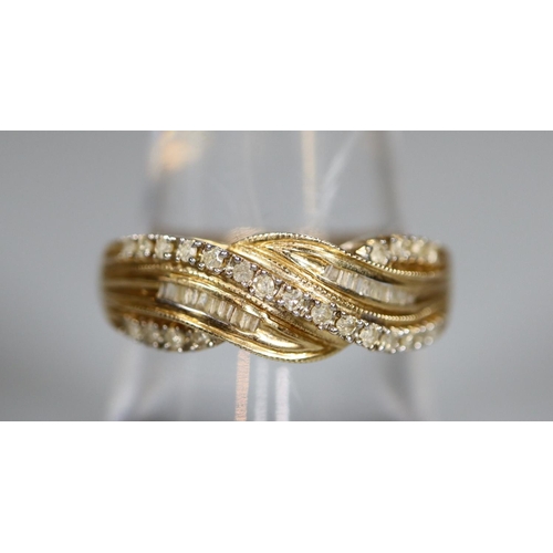 241 - 14ct gold diamond set crossover ring.  Ring size P.  Approx weight 2.7 grams.
(B.P. 21% + VAT)