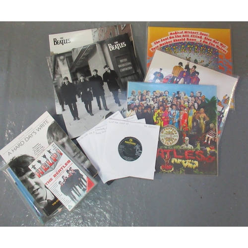 409 - Plastic box of assorted Beatles LPs and related ephemera to include Sargent Pepper live at the BBC v... 