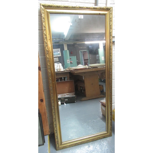 417 - Modern gilt framed mirror of rectangular form carved with flowers. 62 x 133cm approx.
(B.P. 21% + VA... 