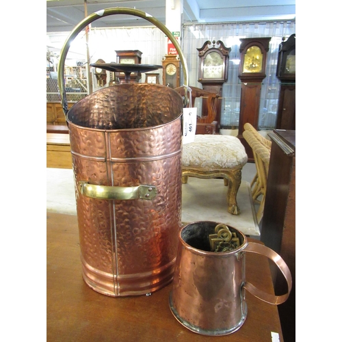 461 - Beaten copper and brass coal/log bin with swing handle, together with a copper tankard.
(B.P. 21% + ... 