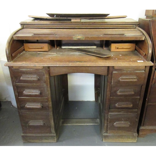 512 - Early 20th century oak tambour knee hole pedestal desk (distressed).
(B.P. 21% + VAT)