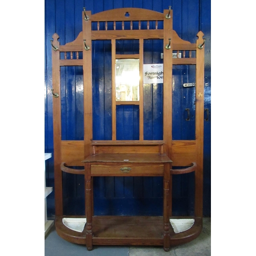 520 - Early 20th century pitch pine, mirror backed ecclesiastical coat stand with turned galleries, centre... 