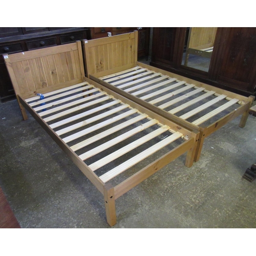 523 - Pair of pine single bed frames with vertically panelled head board. (2)
(B.P. 21% + VAT)