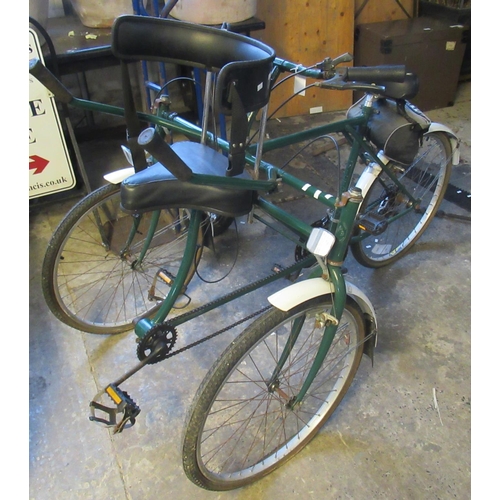 549 - Tricycle tandem with his and hers seating arrangement,  derailleur gears, and two pairs of pedals. 
... 