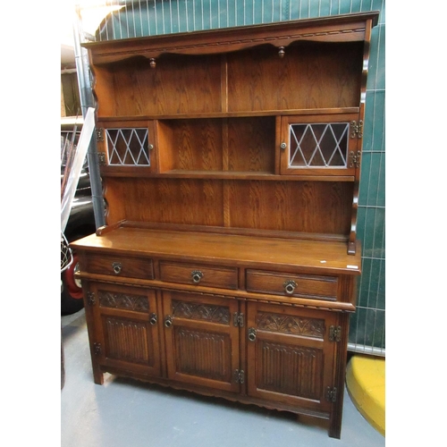 564 - Mid Century oak, 'Old Charm Style' two stage rack backed and lead glazed dresser.
(B.P. 21% + VAT)