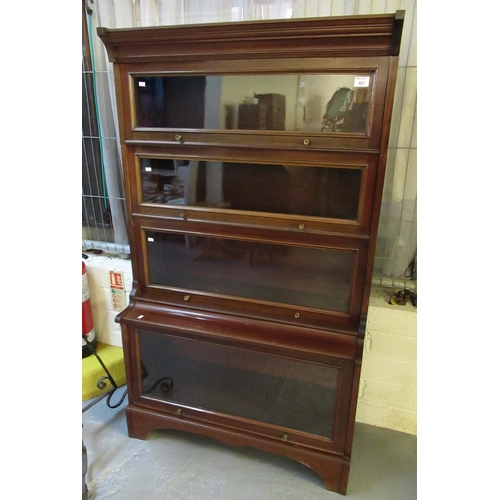 567 - Mid 20th century mahogany stacking four-section glazed bookcase with up-over doors. 86cm wide approx... 