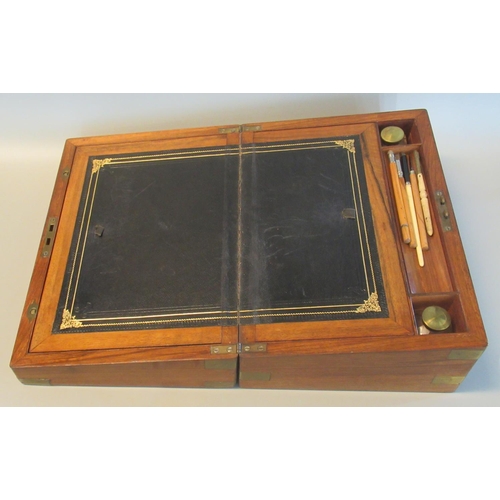 96 - Victorian walnut writing slope with brass mounts, the interior revealing various accessories.
(B.P. ... 