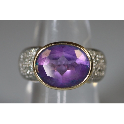 232 - 9ct gold amethyst and diamond ring.  Ring size M&1/2.  Approx weight 5.7 grams.
(B.P. 21% + VAT)