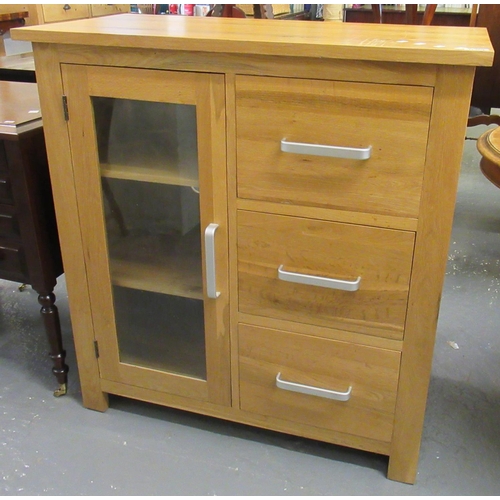 409 - Modern oak narrow display cabinet with fitted drawers, together with a matching oak sideboard and a ... 