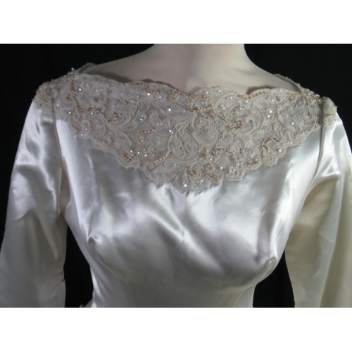 486 - Vintage, possibly 1970s, handmade satin and lace wedding dress with lace neckline adorned with pearl... 