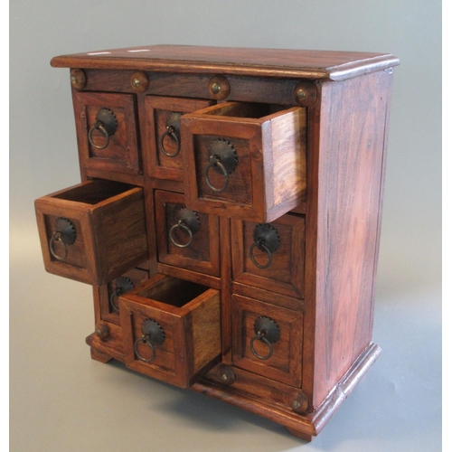 85 - Small, hardwood table top specimen chest having a bank of nine square drawers with metal ring loop h... 