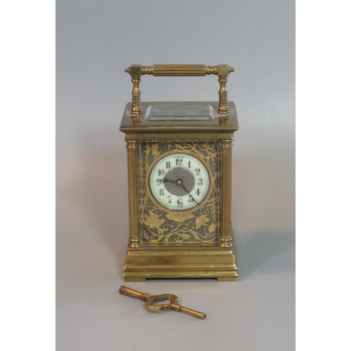 106 - Large French gilt brass carriage clock with Arabic ceramic dial set in a pierced foliate frame work.... 