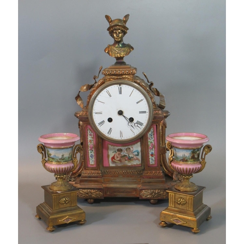 107 - 19th century French ormulu two train clock garniture, the arch case surmounted by a bust of Achilles... 