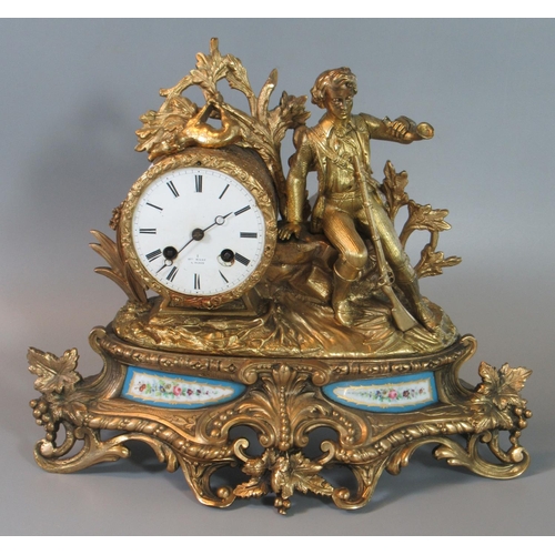 113 - 19th century French yellow metal figure mounted two train mantel clock decorated with figure of a hu... 