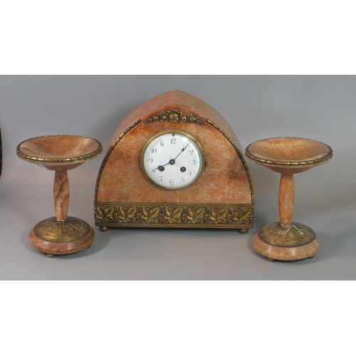 114 - Early 20th century art deco design rouge marble two train clock garniture, the pointed arch clock de... 