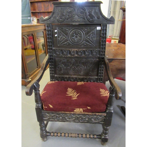 388 - 19th century carved oak Wainscott type chair, the back with carved decoration of flowers, flower hea... 