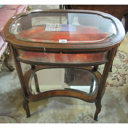 401 - Victorian rosewood bijouterie cabinet of oval form, the glass top with hinged lid and velvet interio... 