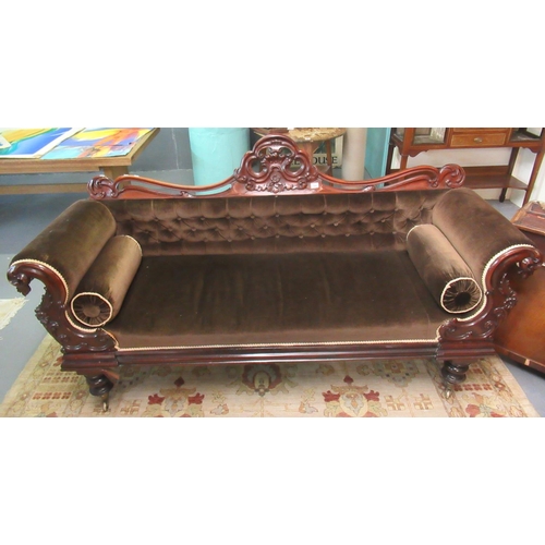 406 - Victorian walnut show frame, double ended sofa, the carved scroll decorated back above padded button... 