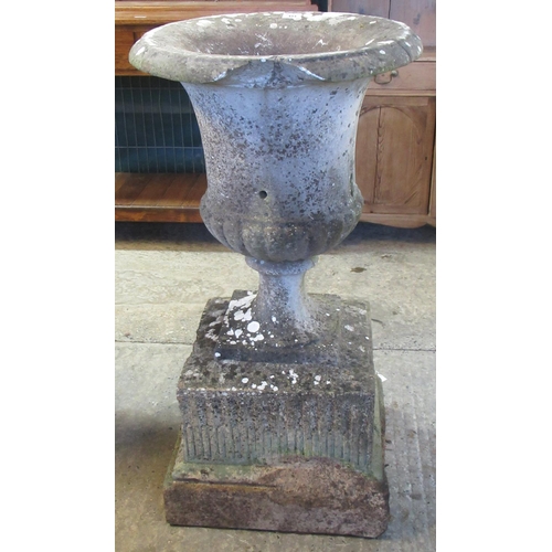 484 - Reconstituted stone Campana shaped garden urn on square fluted base. 54cm diameter, 103cm high appro... 